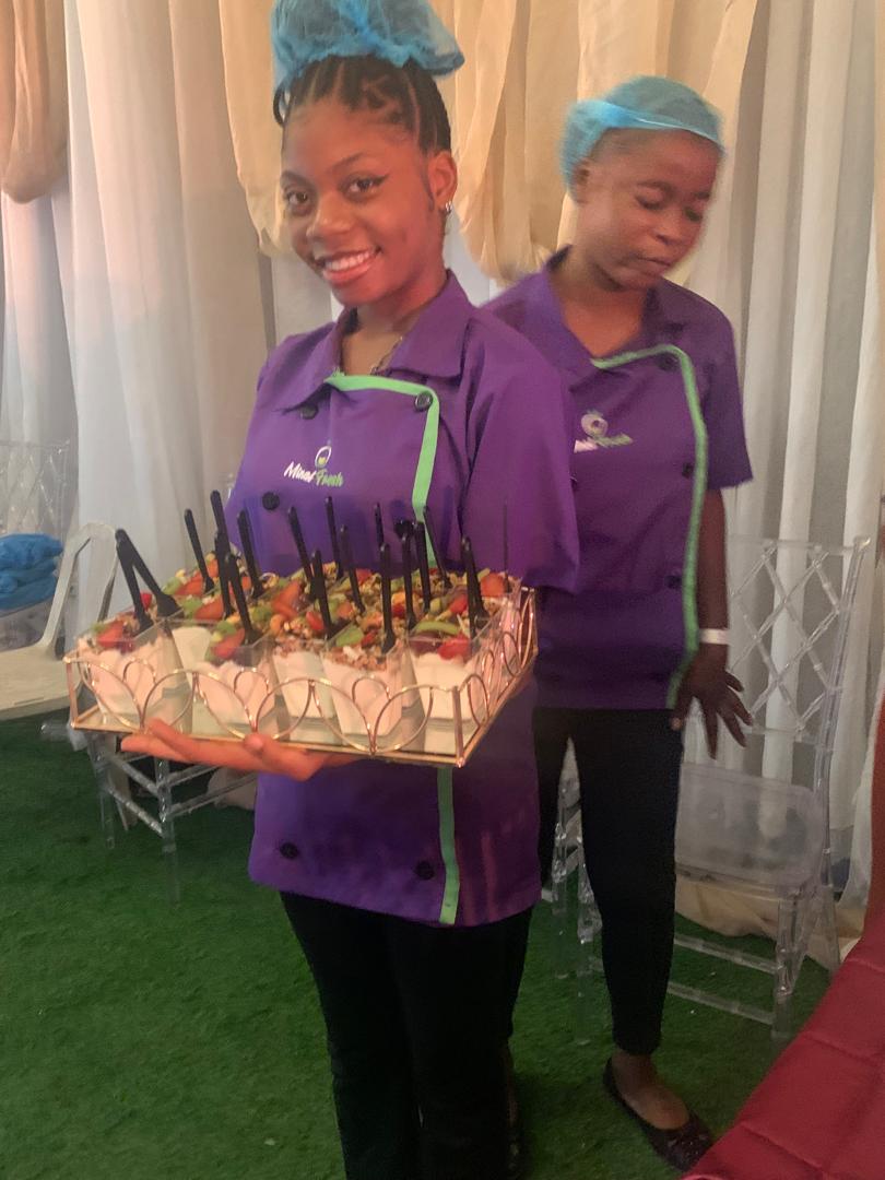 Minat Fresh staff holding a tray of parfaits at a wedding
