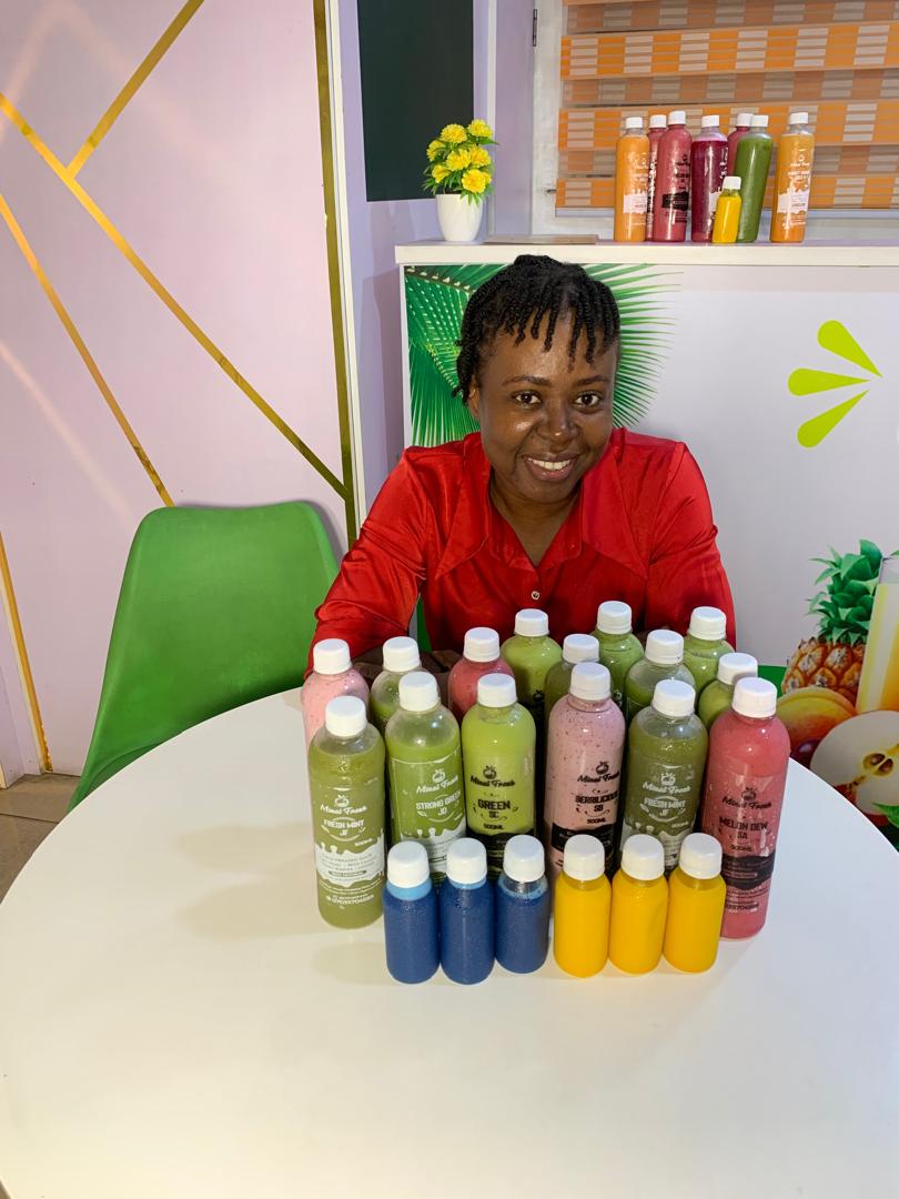 Minat Fresh founder with a full lineup of bottled juices and smoothies at the store